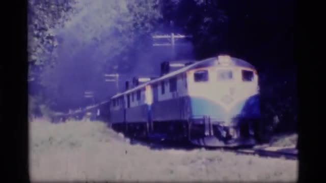 1977: passenger train moving on the tracks in a valley ALASKA