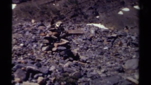 1979: stacked rock rubble at the base of a hill with some snow BRITISH COLUMBIA CANADA
