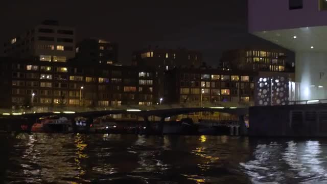 Water tour in night Amsterdam