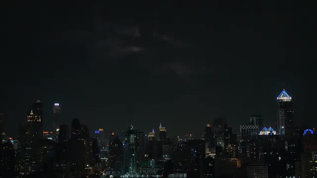 Flash of lightning over night city