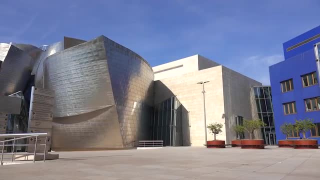 A low wide view of Bilbao Guggenheim entrance