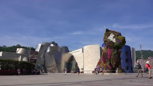 A pan down of the Puppy sculpture at the Guggenheim Bilbao