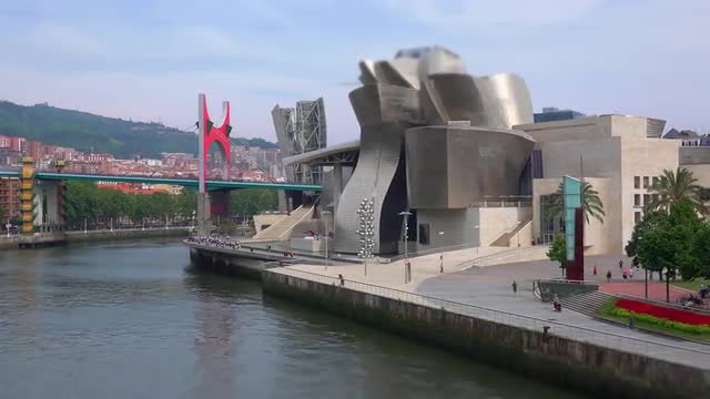 Wide tilit shift Left panning timelapse of Bilbao Guggenheim 
