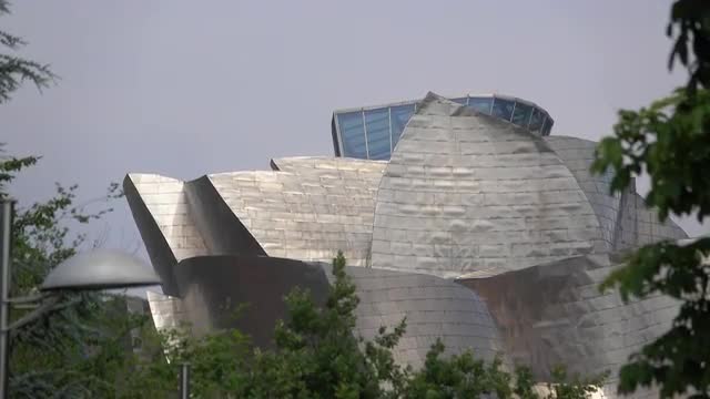 Pan down of the top of the Guggenheim in Bilbao