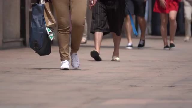 Women shoppers carrying bags