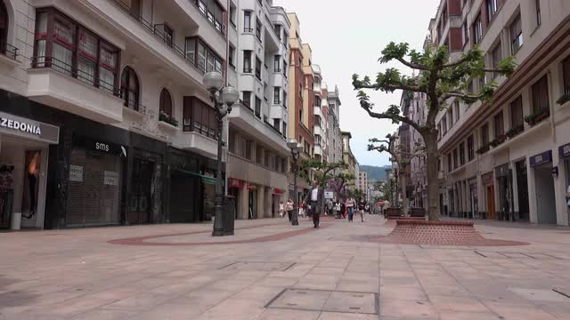 Pan down view of shopping area in Bilbao, Spain