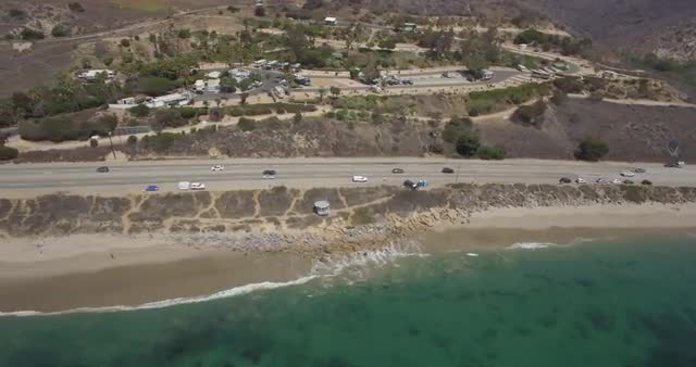 Aerial footage over the Pacific Coast Highway, Malibu Beach, California