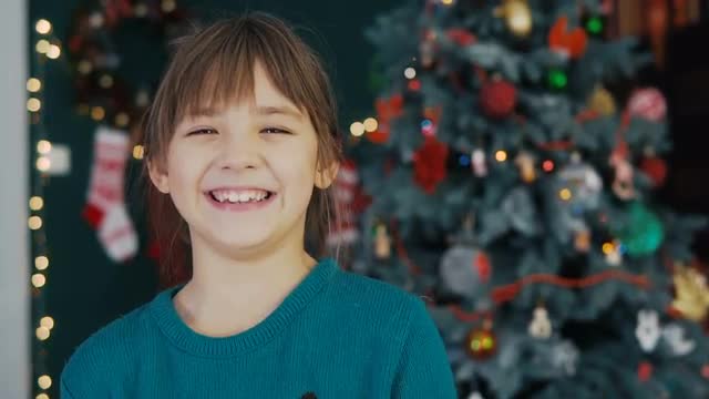 Portrait of Kid Girl Before Christmas Tree