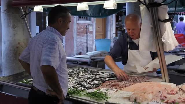 MH Customer Buying Fish in Market / Venice, Italy