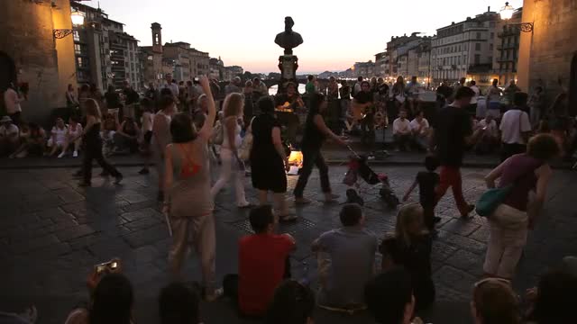 WS LD People Walking Along Ponte Vecchio Bridge at Dusk / Florence, Italy