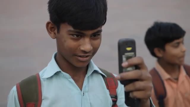 MH Young Boy Taking Photos with Phone / India