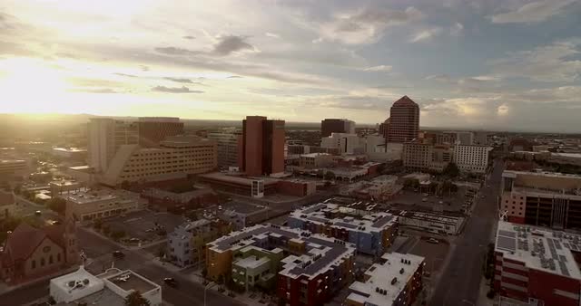 Aerial track of train entering Albuquerque New Mexico with downtown