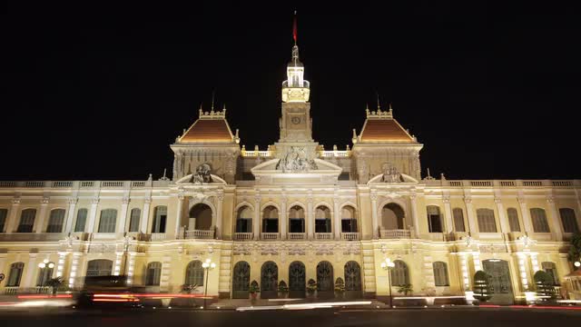 T/L WS LD Traffic Going by Ho Chi Minh City Hall at Night / Ho Chi Minh, Vietnam