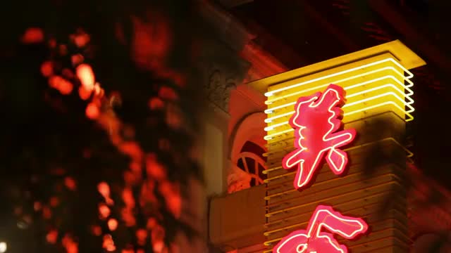CU LA Neon signs illuminated at night / Chinatown, Singapore