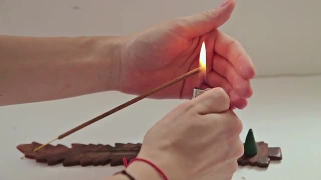 Incense stick burning in the home interior.