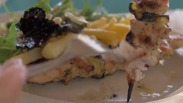 Having meal with chicken, crispy fries and salad