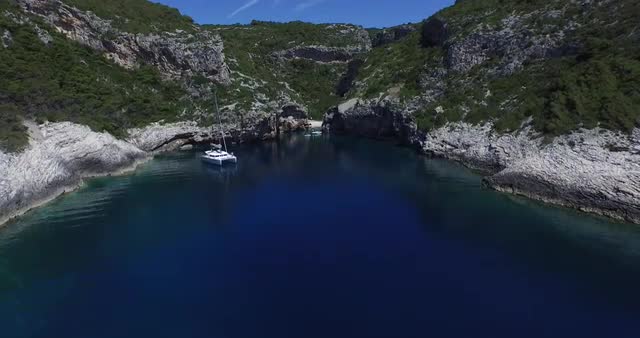 Aerial scene of rocky bay at the dalmatian coast. Drone.Rocky cliff over transparent water