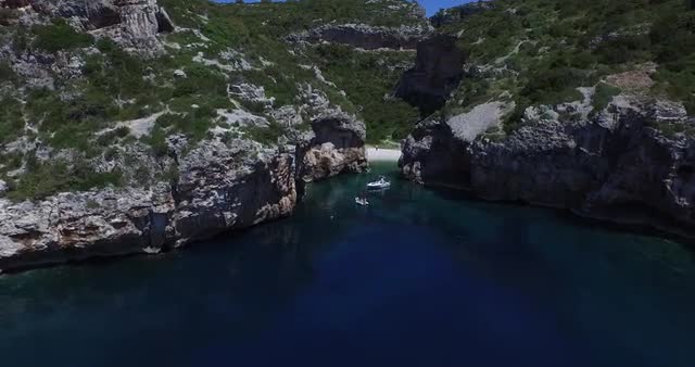 Aerial scene of rocky bay at the dalmatian coast. Drone.Rocky cliff over transparent water