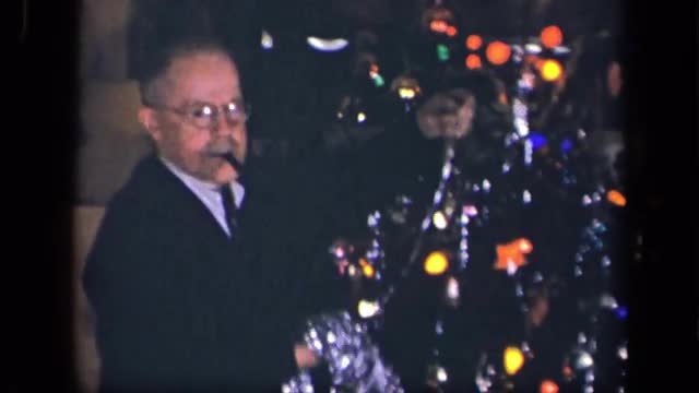 1942: man decorating christmas tree. SEBRING OHIO