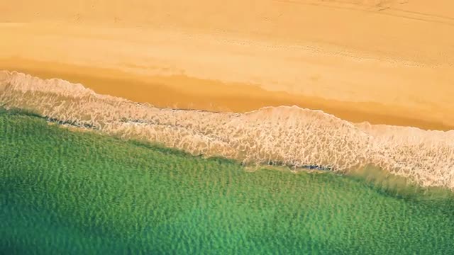Aerial View Small Waves on Sandy Beach