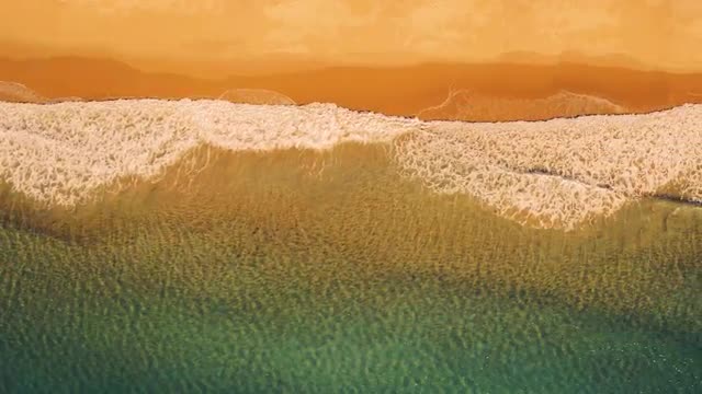 Aerial View Small Waves on Sandy Beach