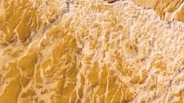 Aerial View Small Waves on Sandy Beach