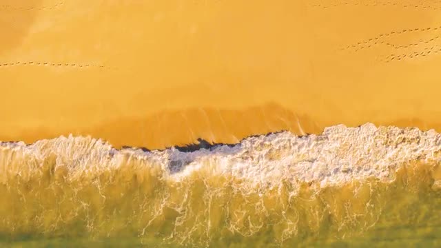 Aerial View Small Waves on Sandy Beach