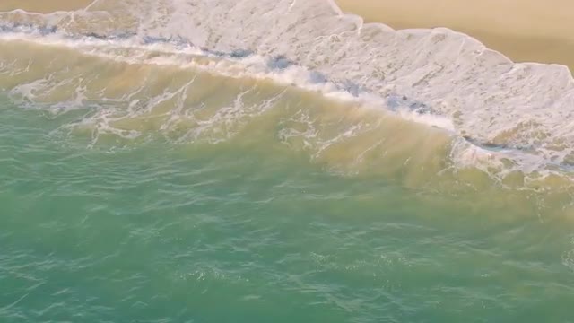 Aerial View Small Waves on Sandy Beach