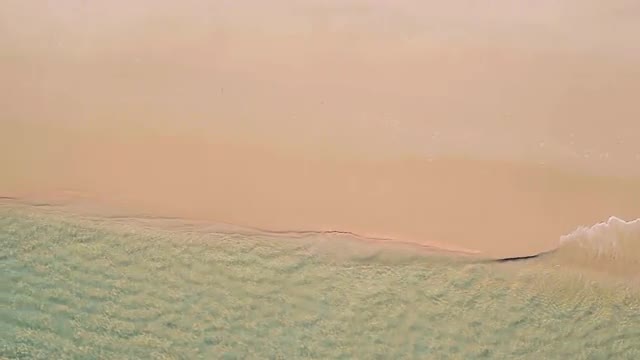 Aerial View Small Waves on Sandy Beach
