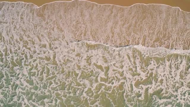Aerial View Small Waves on Sandy Beach