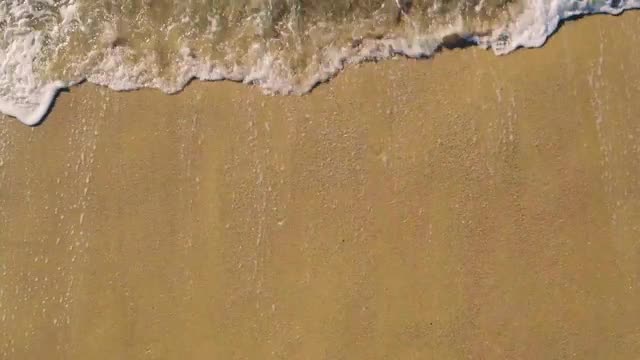 Aerial View Small Waves on Sandy Beach