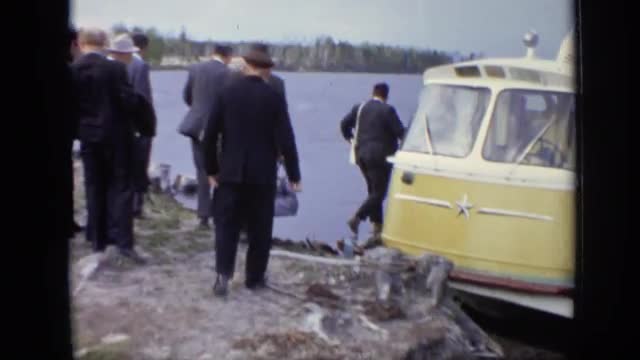 1971: group of men about to get onto ferry. MOSCOW RUSSIA