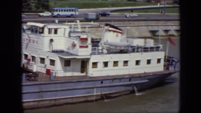 1971: large boat moving along man made river near freeway MOSCOW RUSSIA
