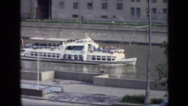 1971: the people were walking and car was moving in road and boat was moving in water MOSCOW RUSSIA
