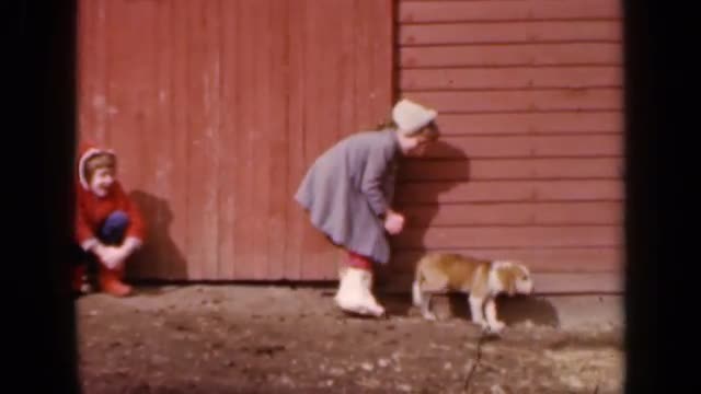 1964: playing with dog KANSAS