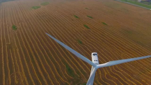 Aerial View. Beautiful windmill turbines sunset , wind energy turbines . Aerial drone shot. 