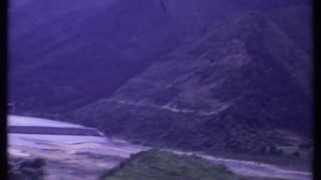 1969: a long and awesome river flowing through the valley with luxuriant vegetation THAILAND