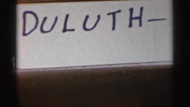 1965: in the video shows the word duluth- it may be a english language or other any language DULUTH 