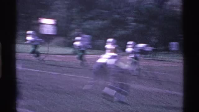 1969: the soccer players playing in the ground,run for a goal,a thrilling experience. OHIO