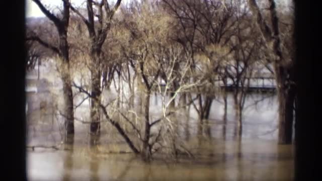 1969: flood waters of the riverside rising through the weekend by four more inches causing concern S