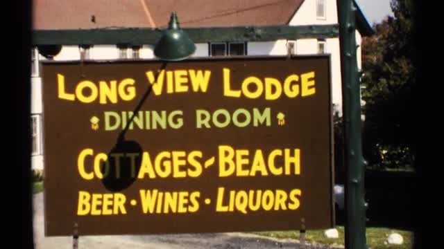 1971: a board that represents a lodge name and the way of dining room of the lodge and a lamp of the