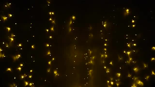 Hypnotizing Lights of Bright Garland That Create Festive Mood on Eve of Christmas.