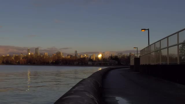 Empty pathway at sunset time with reflections on building