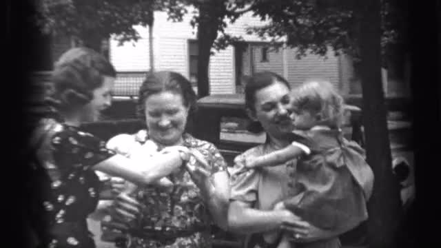 1938: black and white video of a woman in a family CLEVELAND OHIO 1938: black and white video of a woman in a family CLEVELAND OHIO
