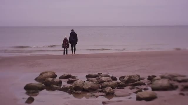 Woman and a Little Girl Froze in Anticipation