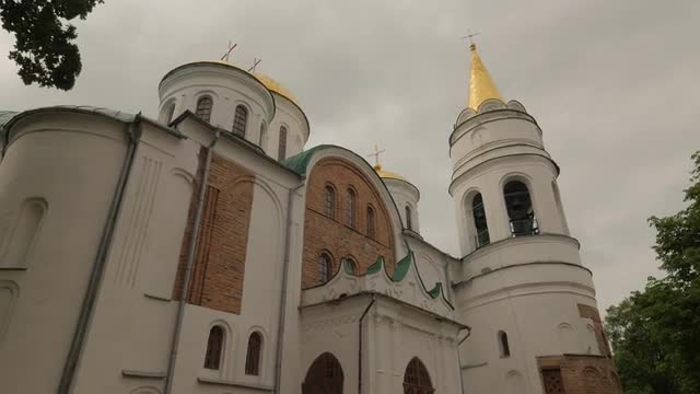 Cathedral White Walls and Towers Orthodox Church on Background of Cloudy Sky Stormy Clouds Spring in