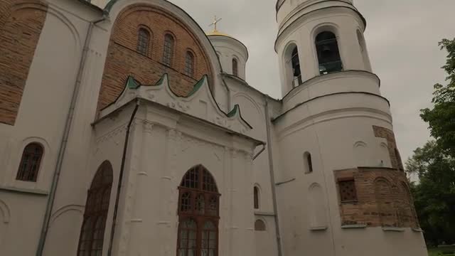 Savior-Transfiguration Cathedral in Springtime Chernihiv Female Worshiper is Walking by Path in Hurr
