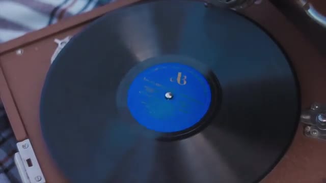 Moving Camera Shooting a Spinning Vinyl