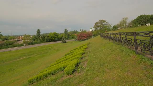 Inscription Chernihiv Made of Cut Bushes Springtime Fresh Landscape Cars on a Road Stormy Clouds Tou