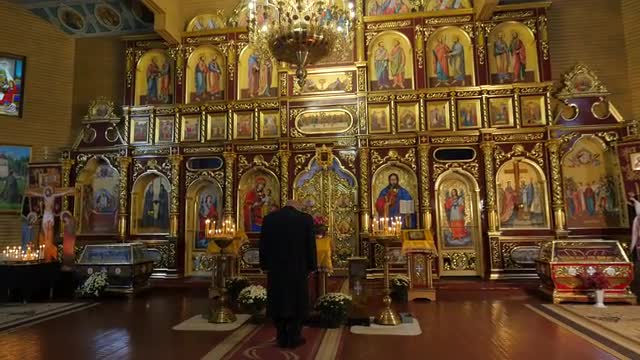 Man in Boris and Gleb Cathedral Theodosius Day Chernihiv Worshiper Bows in Front of Shining Images T